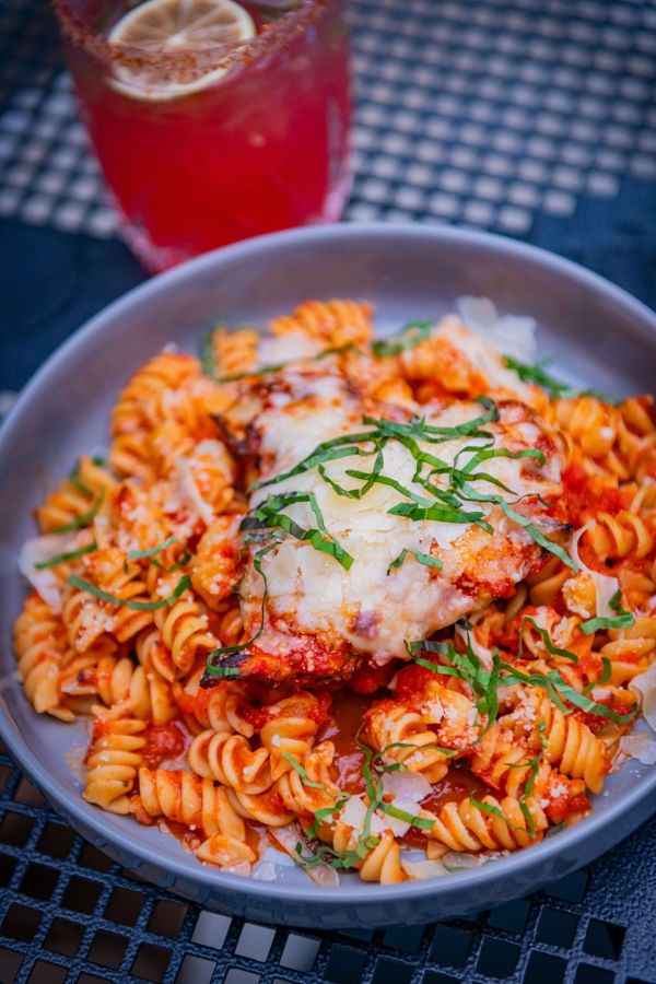 A dish with chicken, pasta, and red sauce