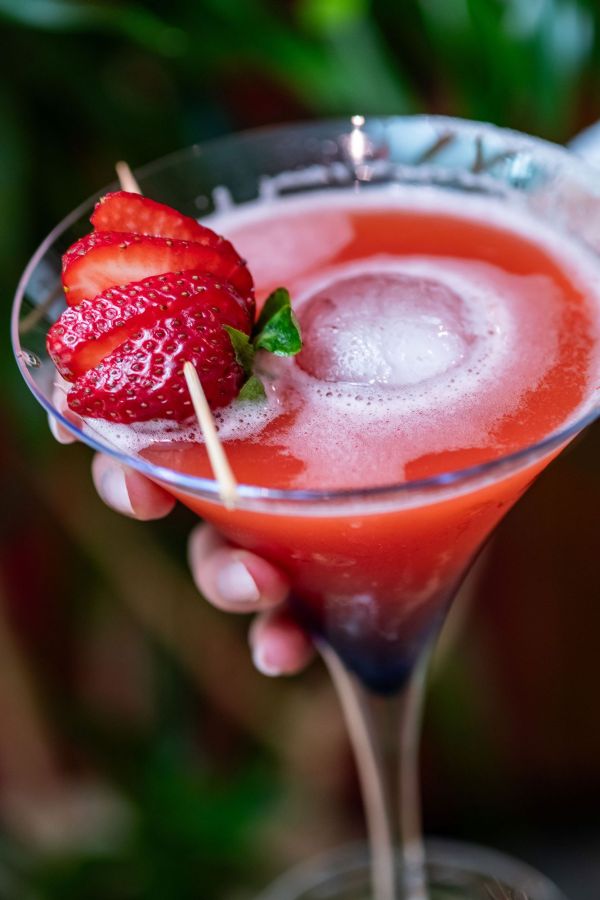 A chilled strawberry daquiri in a martini glass